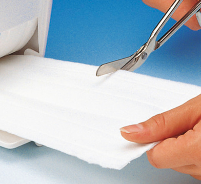Fil-Zellin, the absorbent dressing pad on rolls, may be cut into any shape and is therefore particularly economical in use.