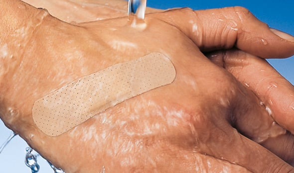 Picture: wadhing hand with a plaster