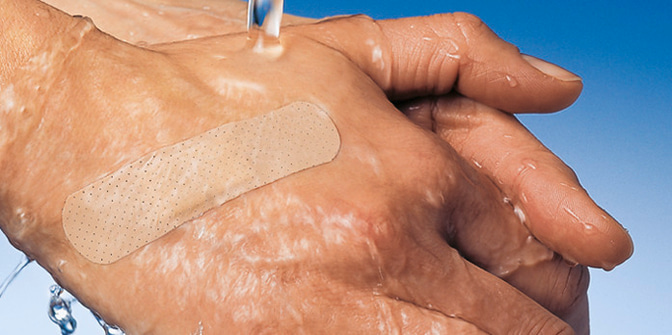 Picture: wadhing hand with a plaster